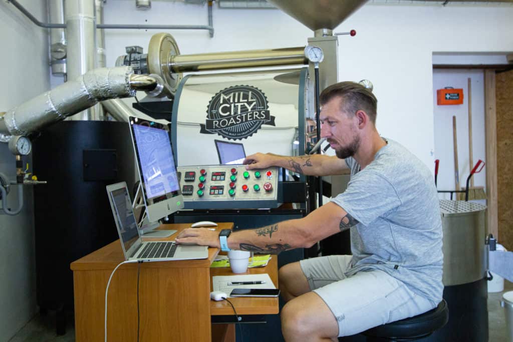 Ondrej Stoksa behind the roasting machine.