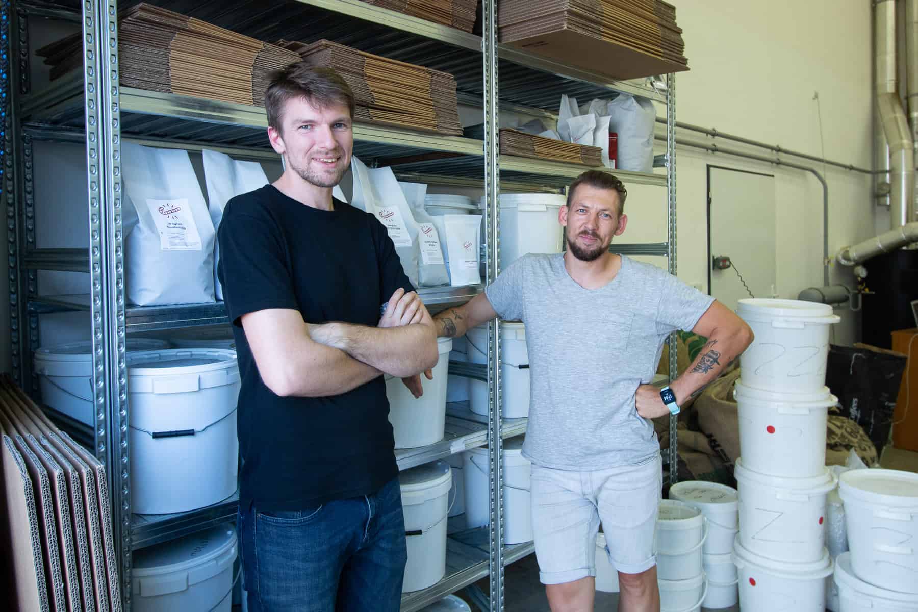 Jaroslav and Ondre at the Candycano Coffee Roastery (shelfs with coffee)